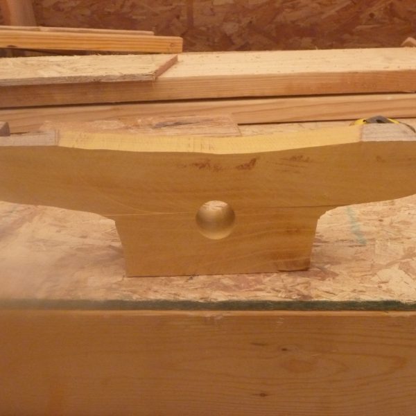 A side deck cleat is cut out before final shaping.
